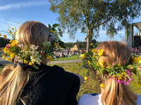 My daughters with their St. Hans floral wreaths